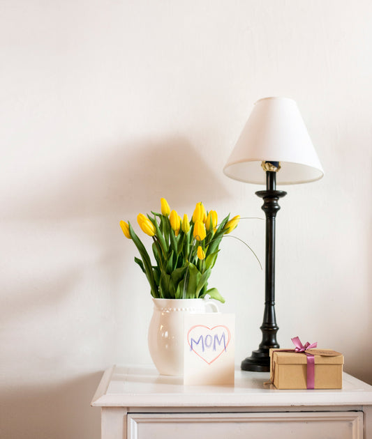 A side table with all kinds of mother's day goodies.